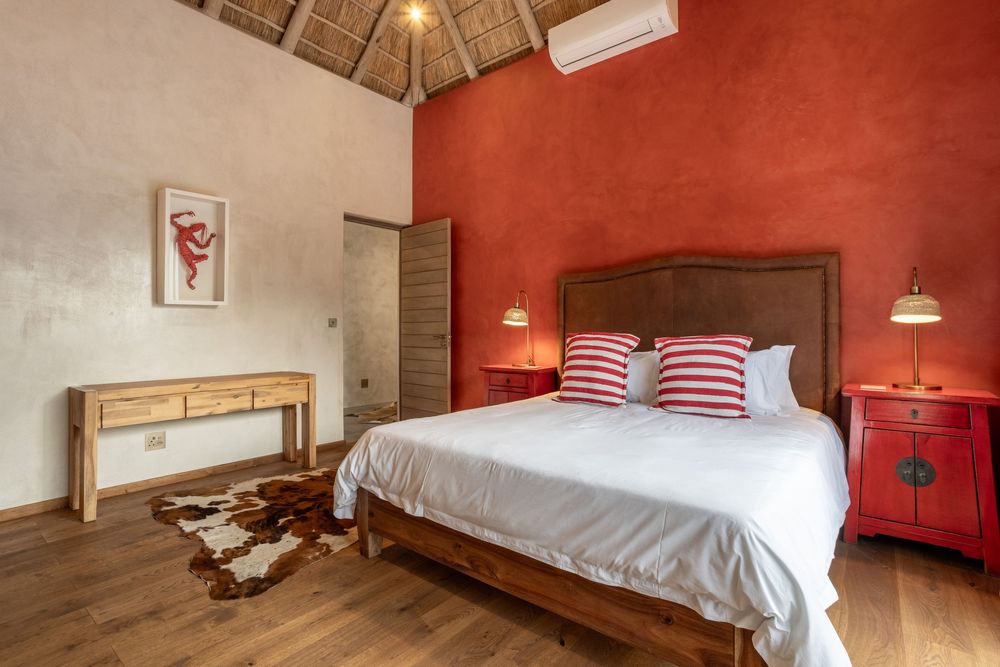 Elegant master bedroom with en-suite bathroom and balcony view
