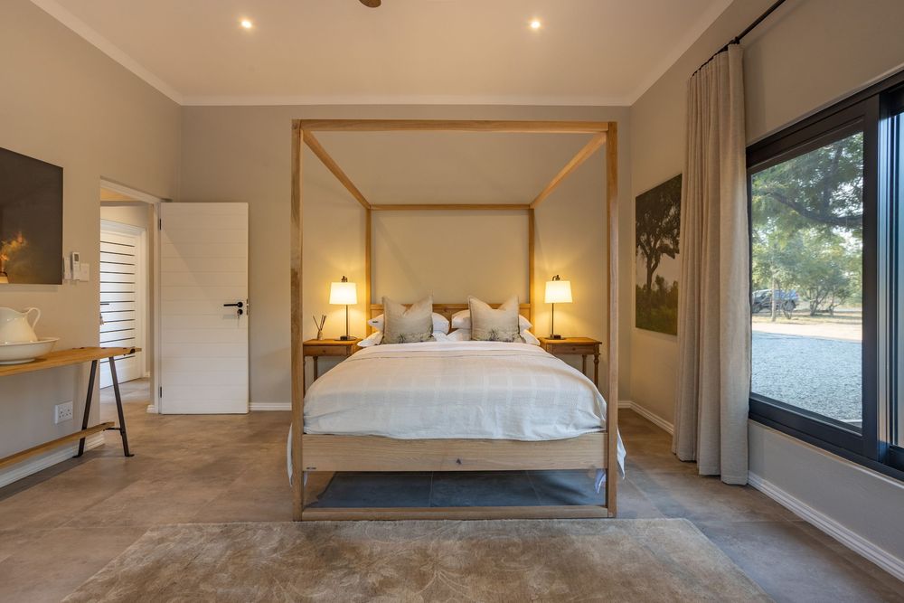 Master bedroom styled with crisp linen and warm natural light