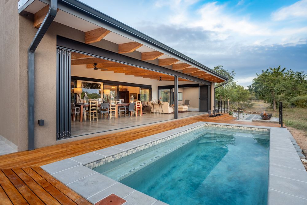 Luxury villa pool deck at golden hour